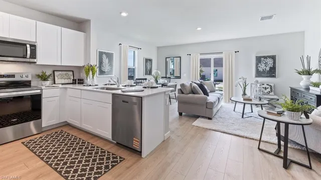 a open kitchen with sink cabinets and stove top oven