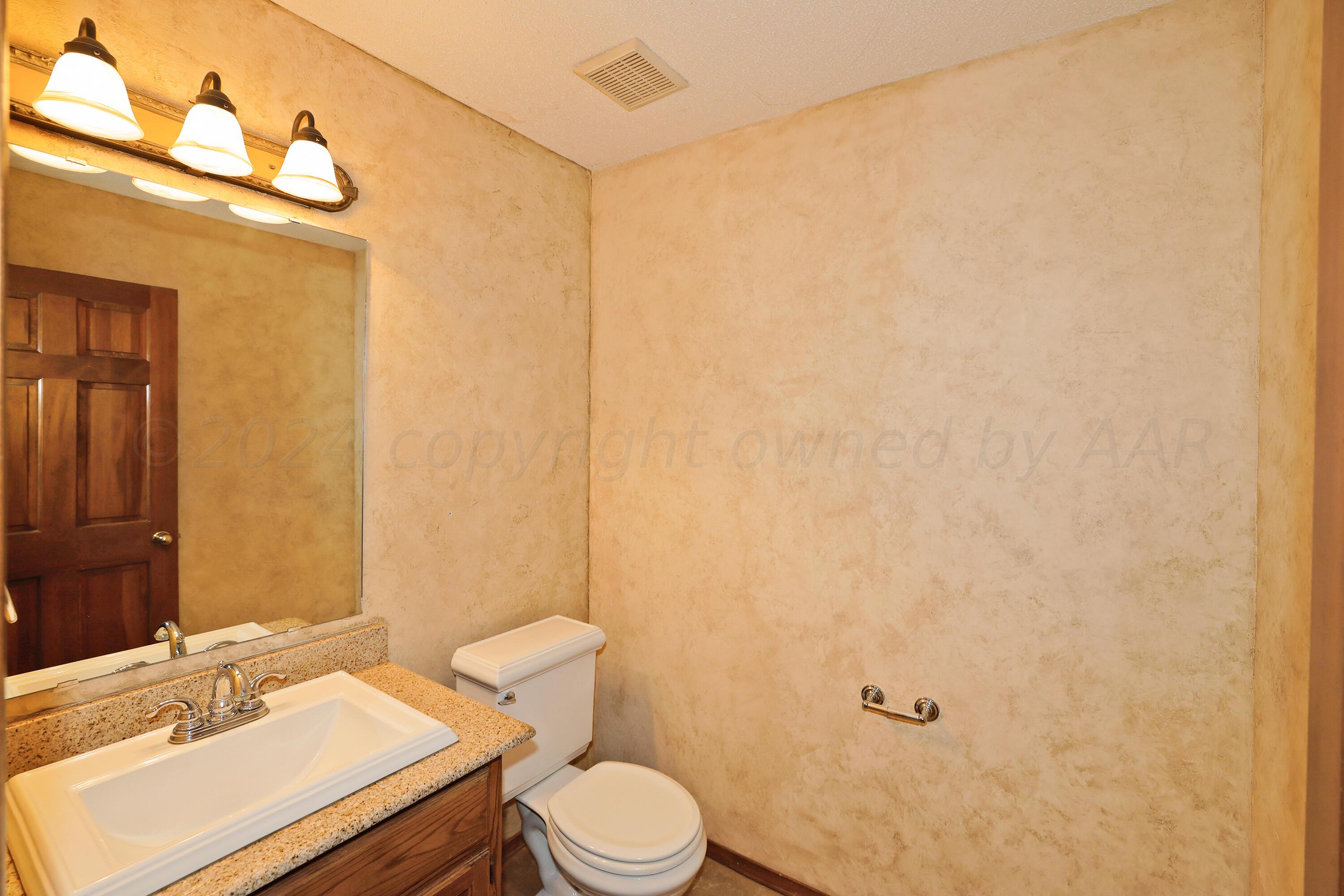 6819 Cloud Crest Drive Amarillo, TX 79124 - Photo 16 of 37 a bathroom with a sink a toilet and shower curtain