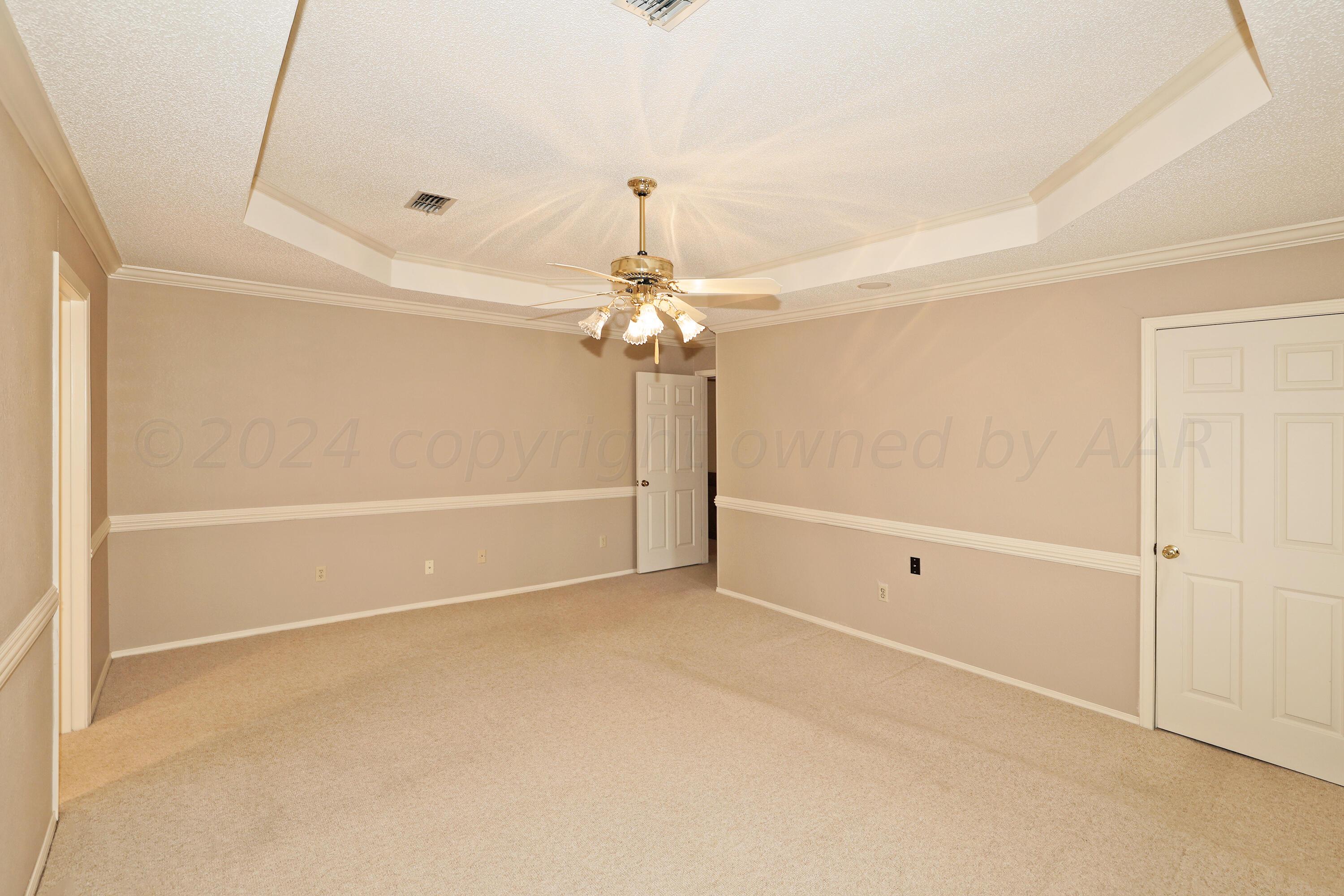 6819 Cloud Crest Drive Amarillo, TX 79124 - Photo 20 of 37 an empty room with a ceiling fan