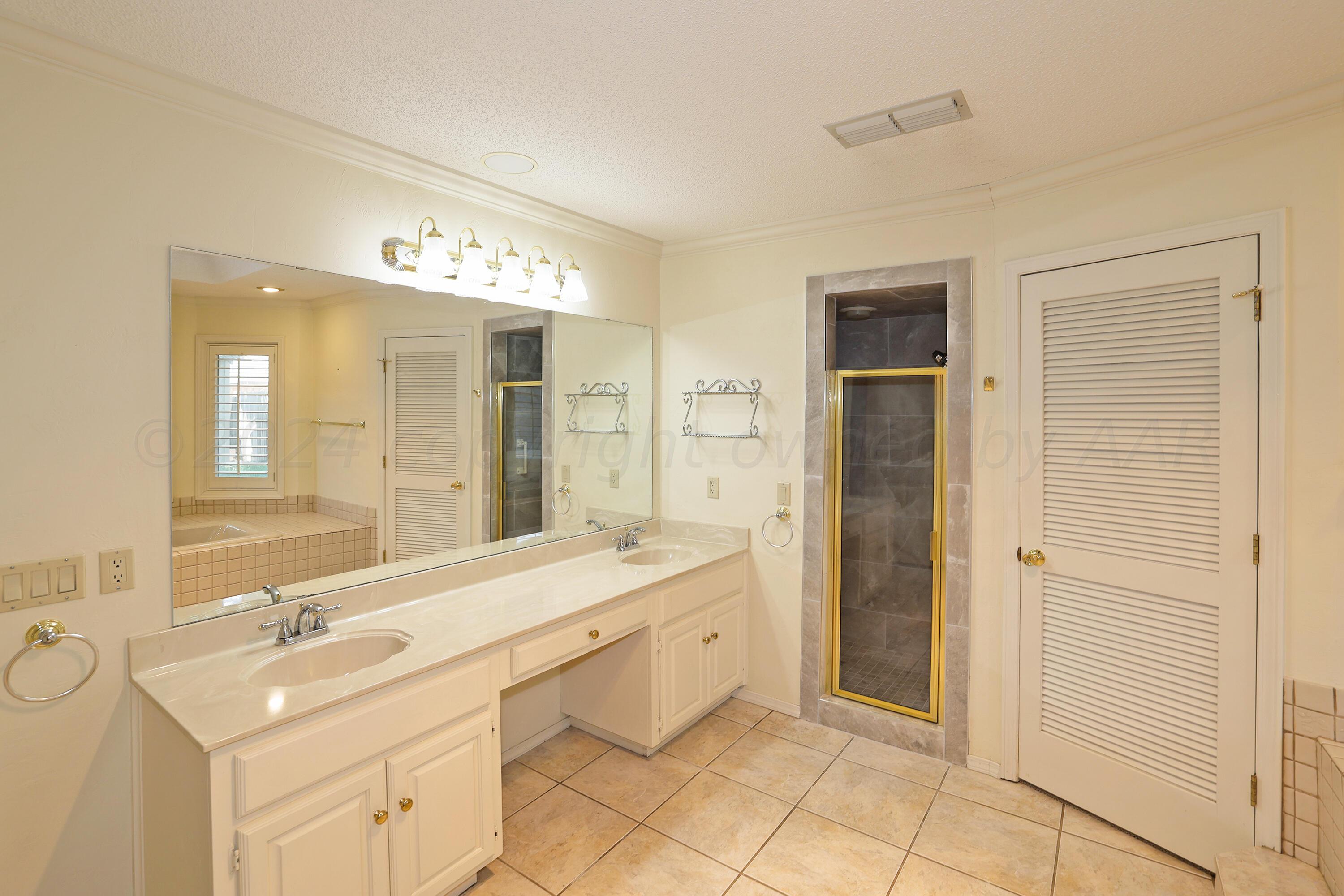 6819 Cloud Crest Drive Amarillo, TX 79124 - Photo 22 of 37 a spacious bathroom with a double vanity sink mirror and double