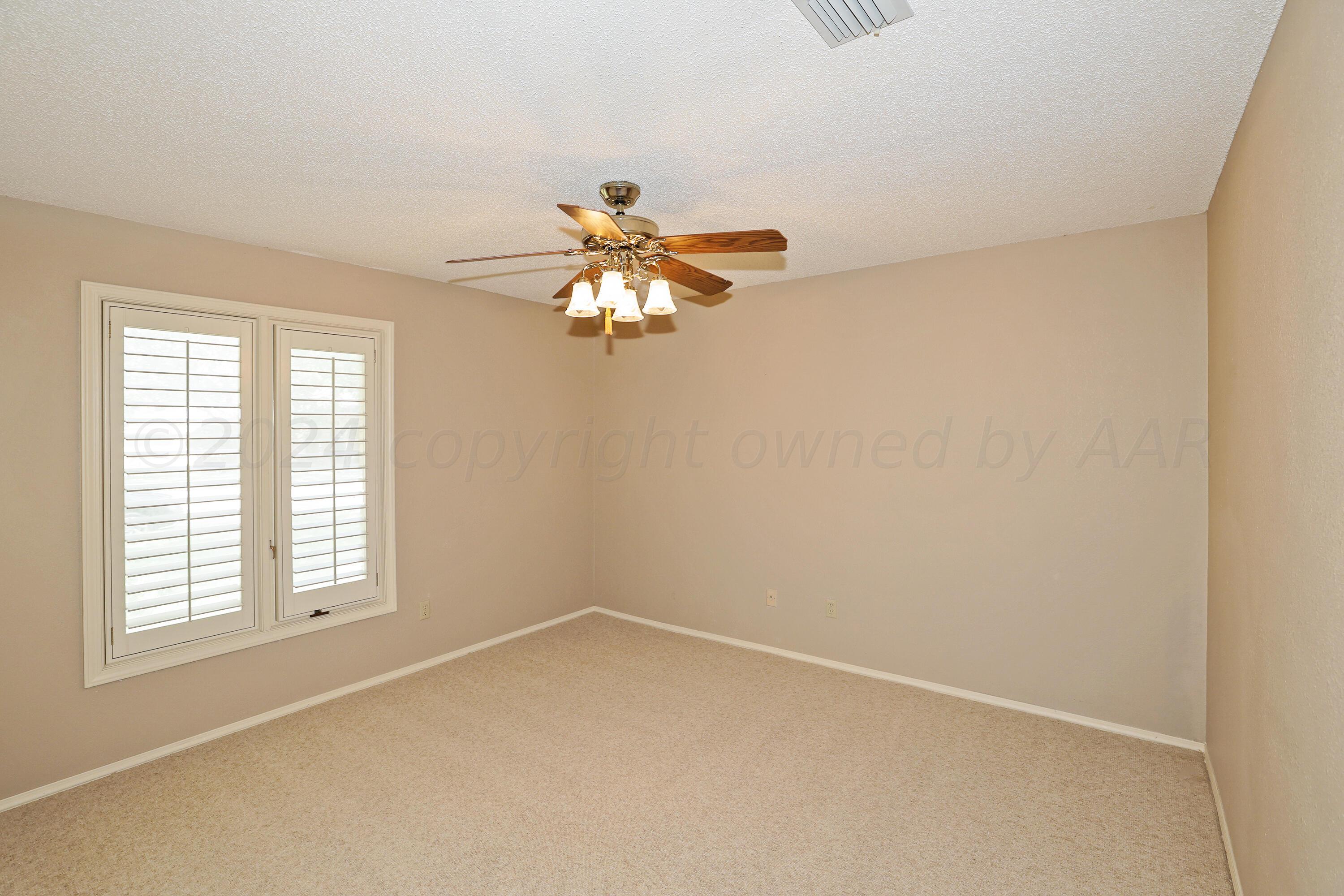 6819 Cloud Crest Drive Amarillo, TX 79124 - Photo 25 of 37 an empty room with a window and a fan