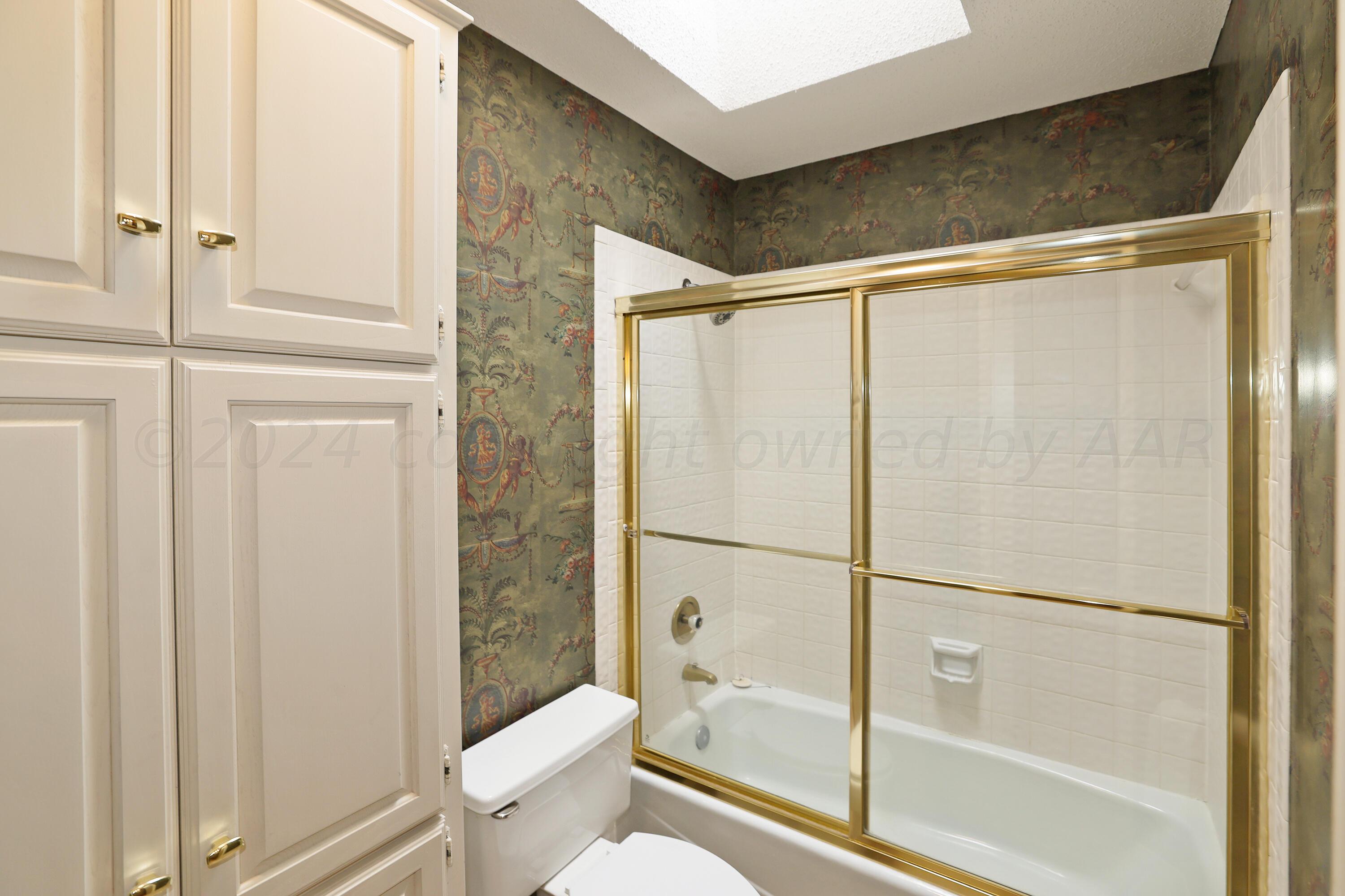 6819 Cloud Crest Drive Amarillo, TX 79124 - Photo 30 of 37 a bathroom with a shower and a toilet