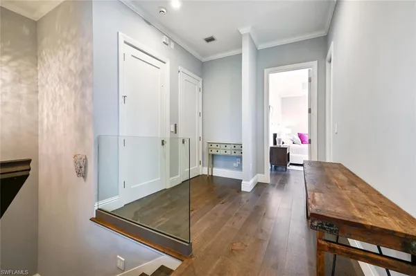 wooden floor with table and chairs in living room