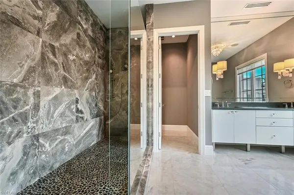 a bathroom with a shower and a sink