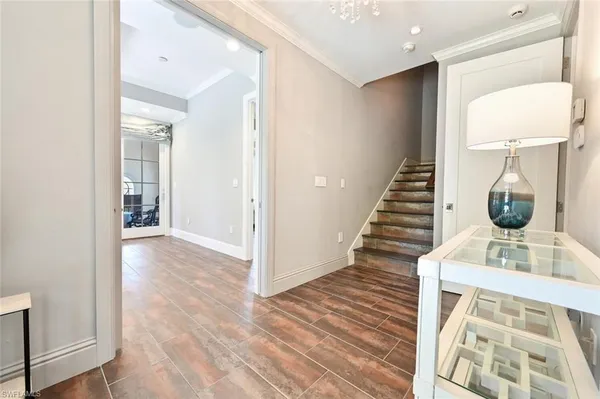 a view of entryway with wooden floor