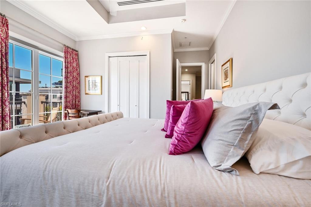 433 5th Street South Naples, FL 34102 - Photo 35 of 39 a bed room with a bed and a couch