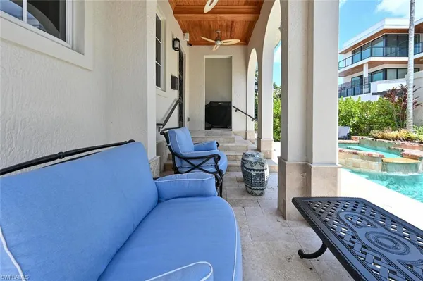 a outdoor living space with furniture and a rug