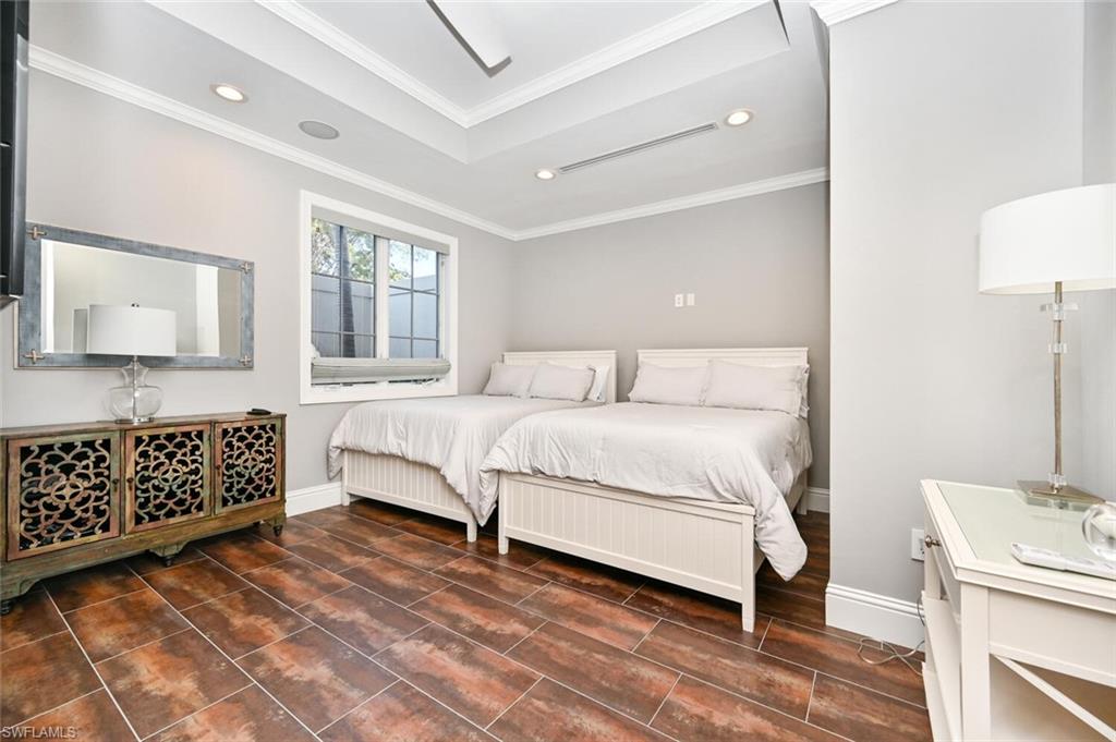 433 5th Street South Naples, FL 34102 - Photo 6 of 39 a bedroom with a large bed and a window