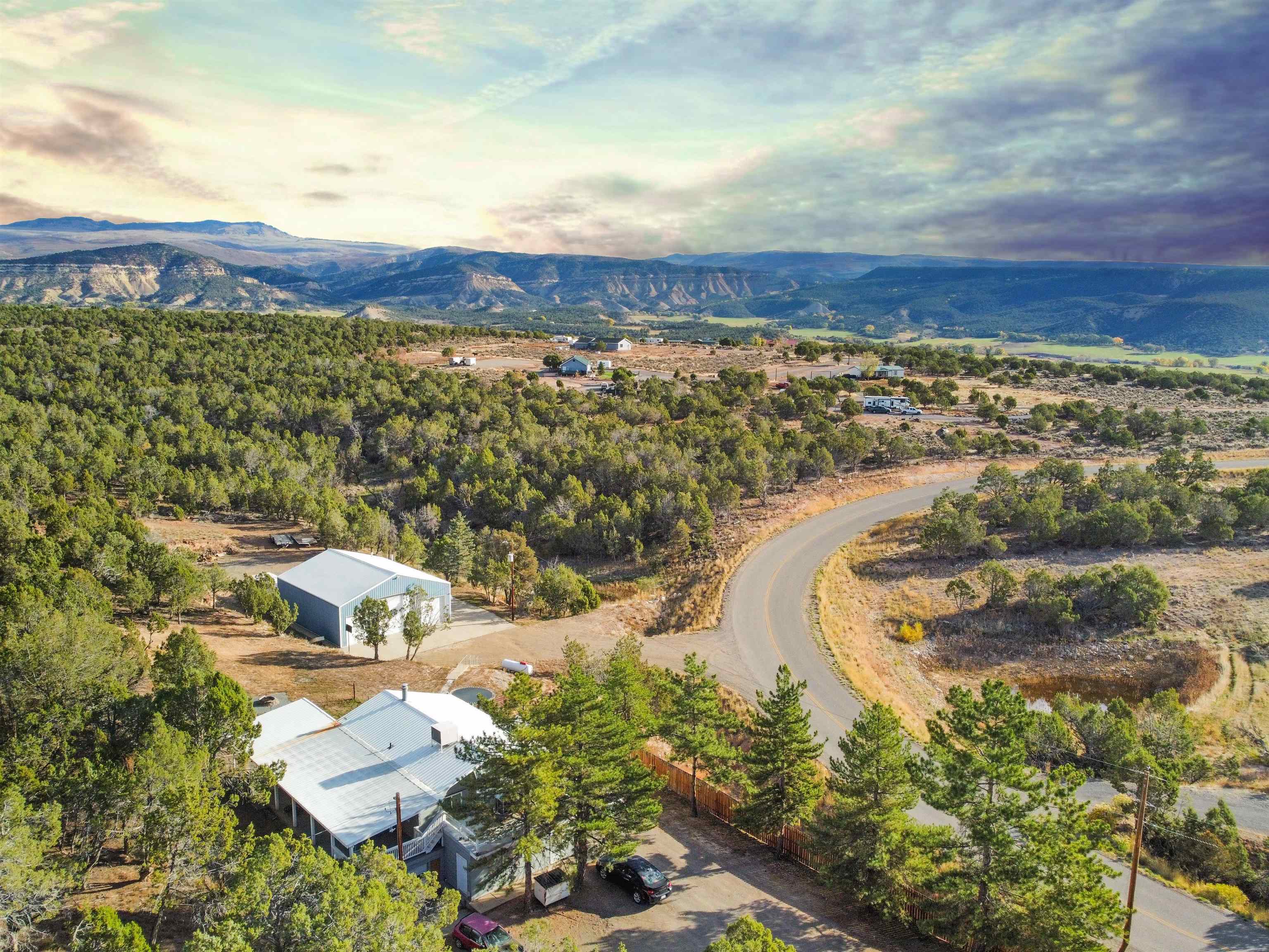 26767 Cedar Mesa Road Cedaredge, CO 81413 - Photo 28 of 28 an aerial view of residential houses with outdoor space