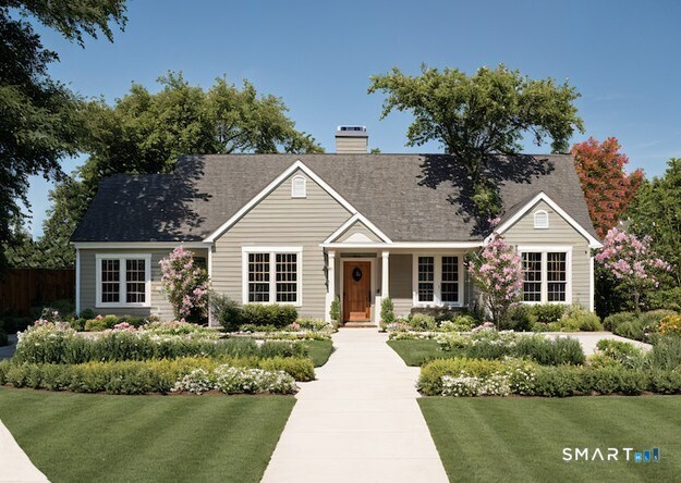 446 Maple Hill Avenue Newington, CT 06111 - Photo 9 of 13 a front view of a house with a yard