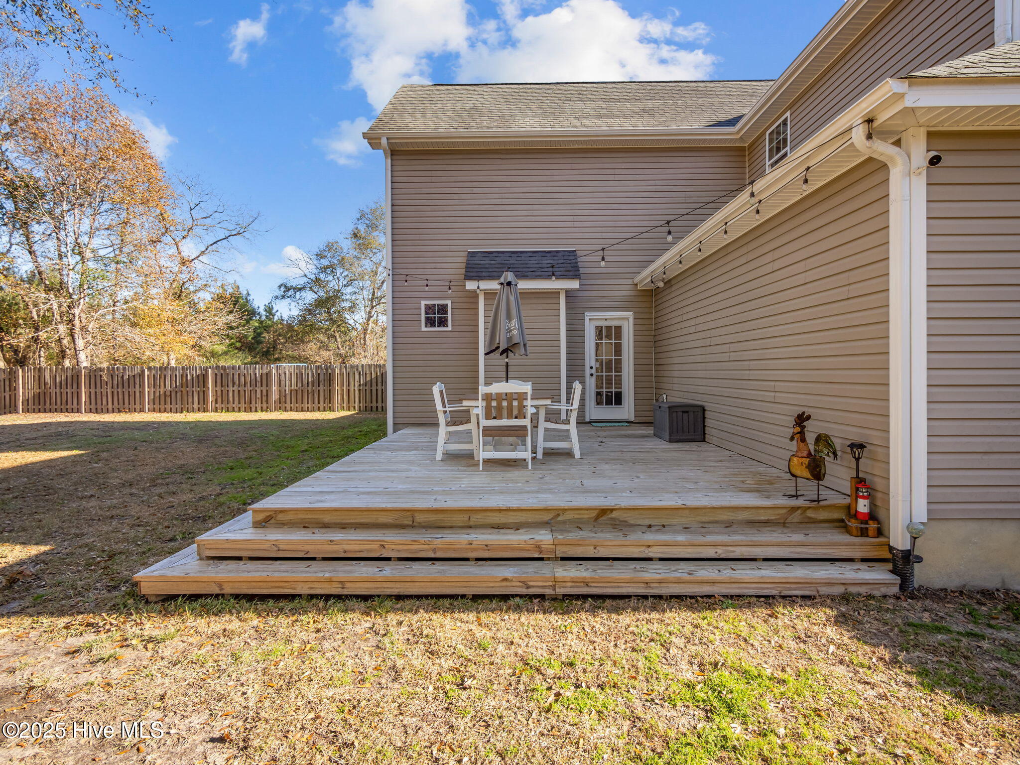 123 Beagle Drive Hubert, NC 28539 - Photo 15 of 53 Living room door leads to 3 tier newer deck!