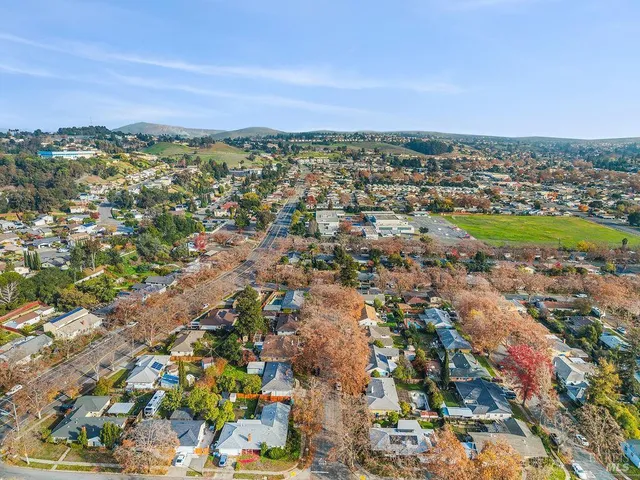 aerial view of a house with a yard
