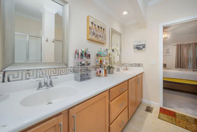 a bedroom with a bed and a television