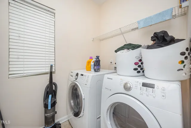 a bathroom with a sink a toilet and shower curtain