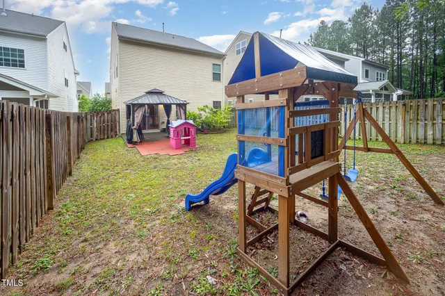 a sign board with wooden fence