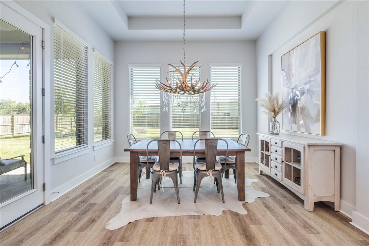 101 Lake Spring Circle Georgetown, TX 78633 - Photo 12 of 40 a view of a dining room with furniture window and outside view