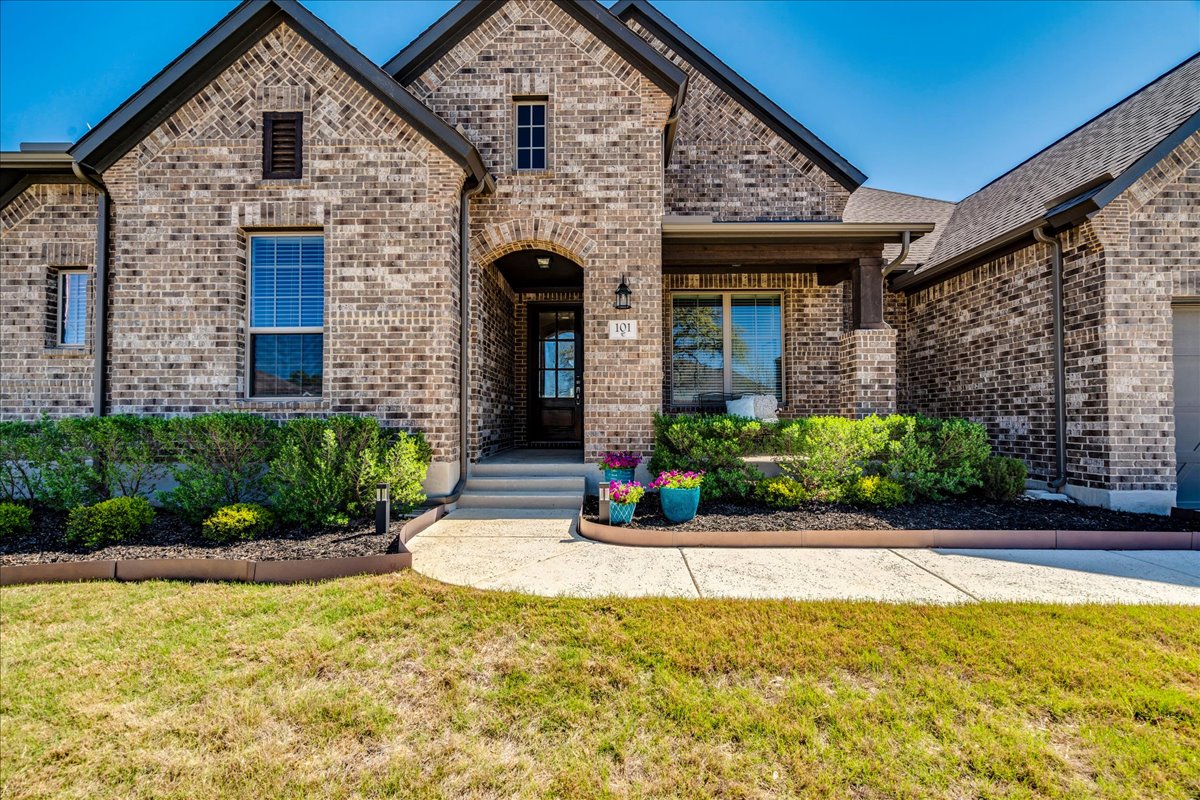 101 Lake Spring Circle Georgetown, TX 78633 - Photo 4 of 40 a view of a house with potted plants