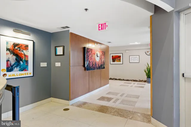a view of hallway with wooden floor