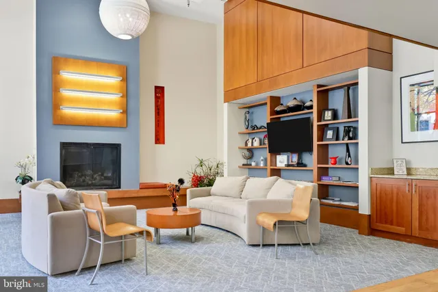 a view of a house with a large tree and a yard