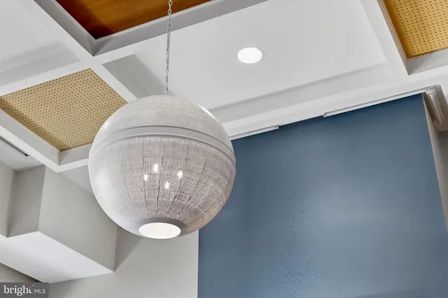 a view of a chairs and table in the back yard of the house