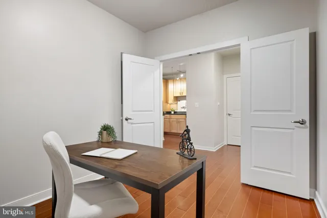 a kitchen with granite countertop a sink a stove and cabinets