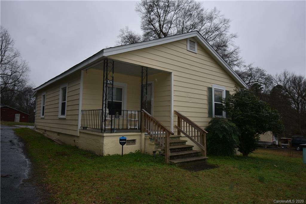 325 Queens Road Gastonia, NC 28052 - Photo 2 of 4 a view of a house with a yard
