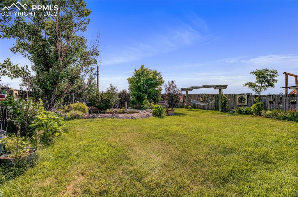 33895 East Jones Road Yoder, CO 80864 - Photo 11 of 45 a swimming pool with trees in the background
