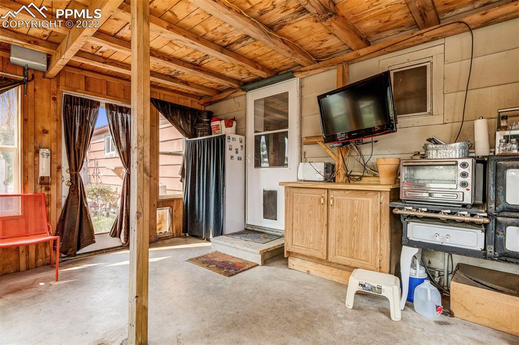 33895 East Jones Road Yoder, CO 80864 - Photo 12 of 45 a living room with furniture and a flat screen tv