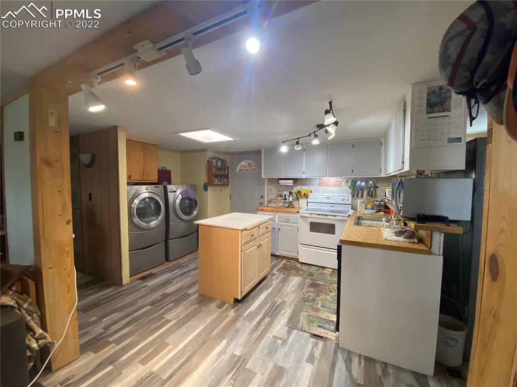 33895 East Jones Road Yoder, CO 80864 - Photo 14 of 45 a kitchen with stainless steel appliances granite countertop a refrigerator a stove top oven a sink and dishwasher