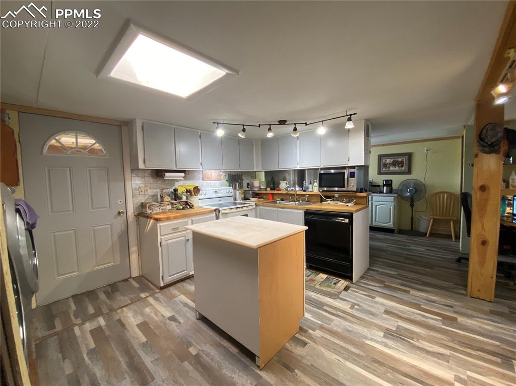 33895 East Jones Road Yoder, CO 80864 - Photo 15 of 45 a kitchen with refrigerator and cabinets