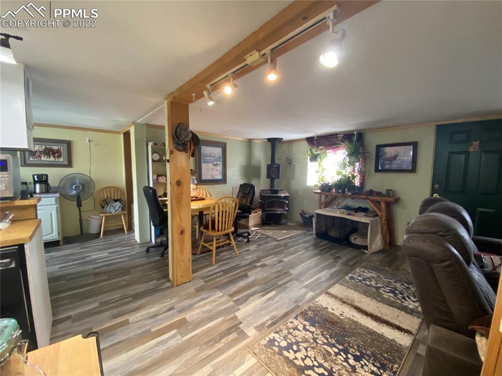 33895 East Jones Road Yoder, CO 80864 - Photo 17 of 45 a living room with furniture a rug and gym equipment