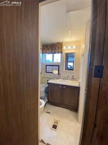 a bathroom with a sink a mirror and a bathtub