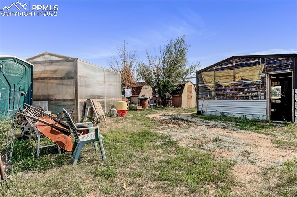 33895 East Jones Road Yoder, CO 80864 - Photo 31 of 45 a front view of a house with garden