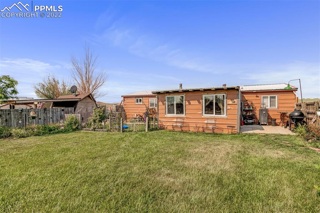 33895 East Jones Road Yoder, CO 80864 - Photo 4 of 45 a front view of a house with a garden