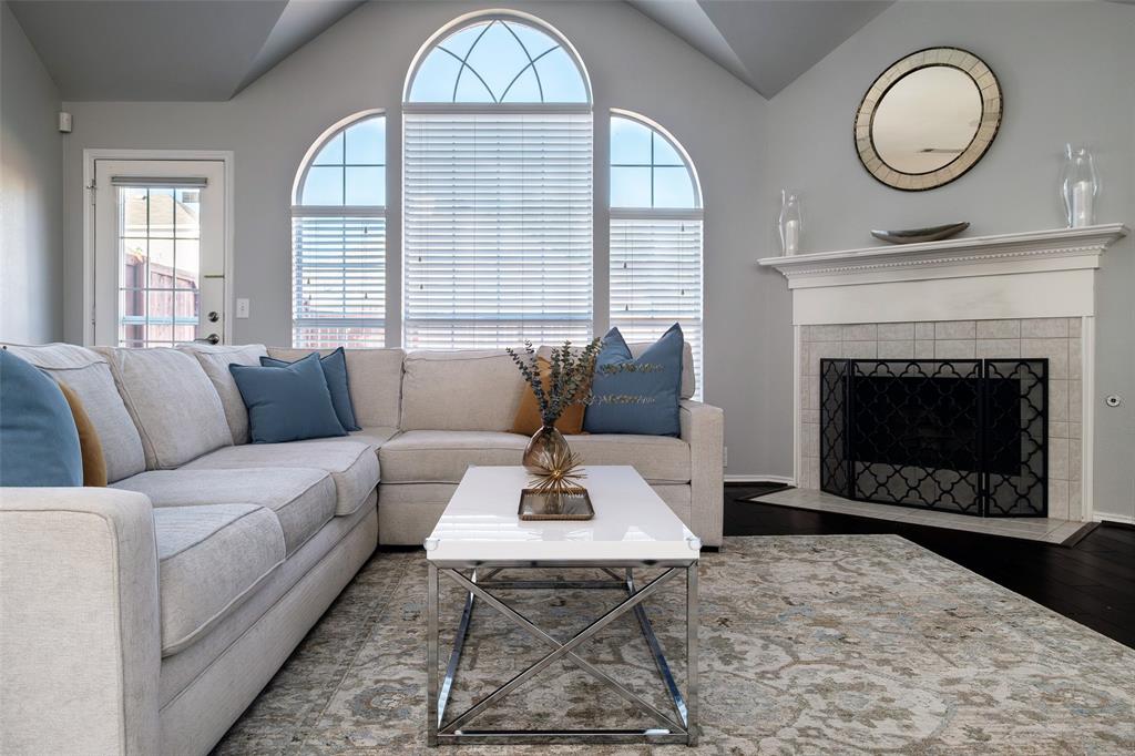 2513 Hunters Run Drive Plano, TX 75025 - Photo 1 of 36 a living room with furniture a fireplace and window