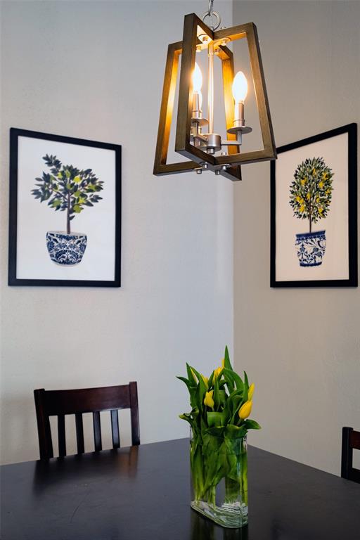 2513 Hunters Run Drive Plano, TX 75025 - Photo 12 of 36 a vase with flowers on a table with a potted plant