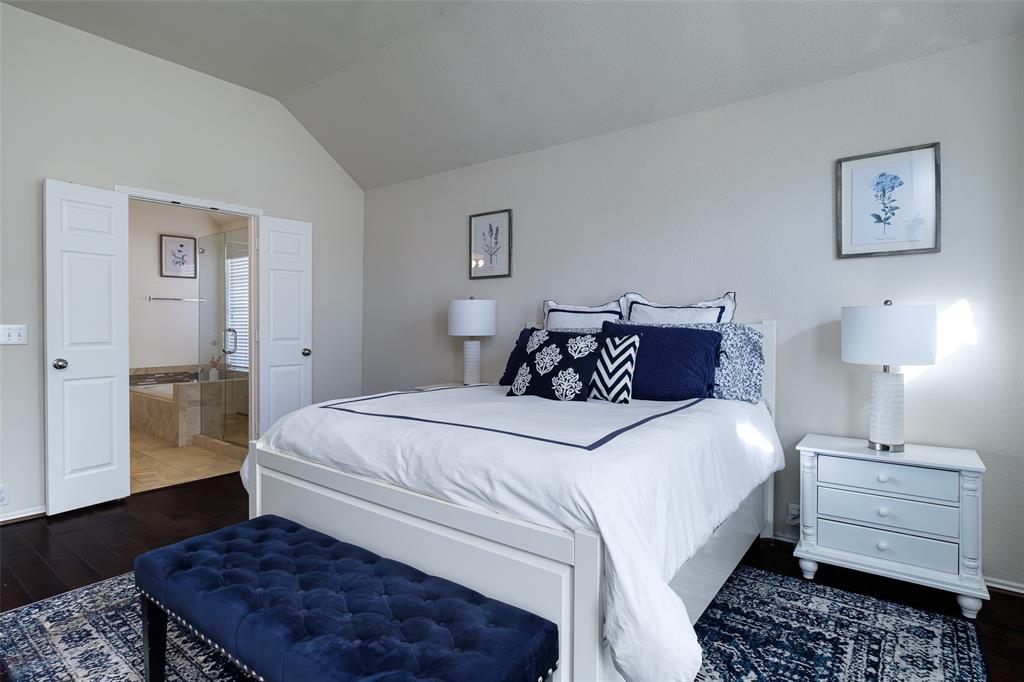 2513 Hunters Run Drive Plano, TX 75025 - Photo 20 of 36 a bedroom with bed and wooden floor