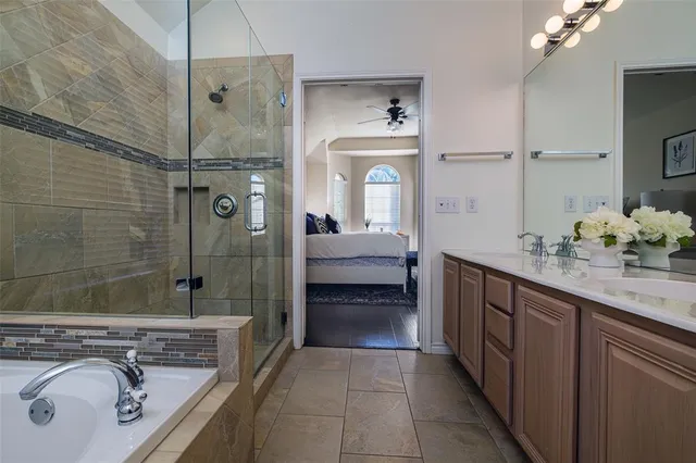 a bathroom with a sink double vanity and shower