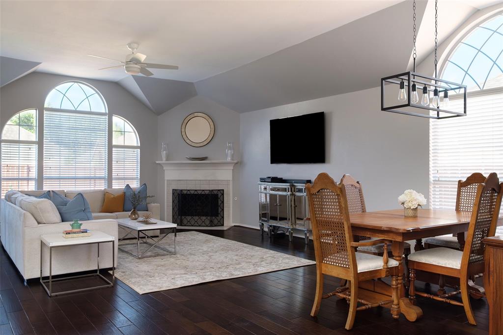 2513 Hunters Run Drive Plano, TX 75025 - Photo 8 of 36 a living room with furniture a fireplace and a flat screen tv