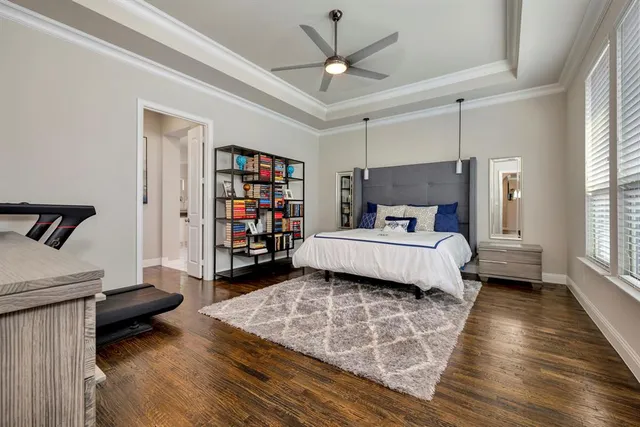 a bedroom with a bed and a book shelf