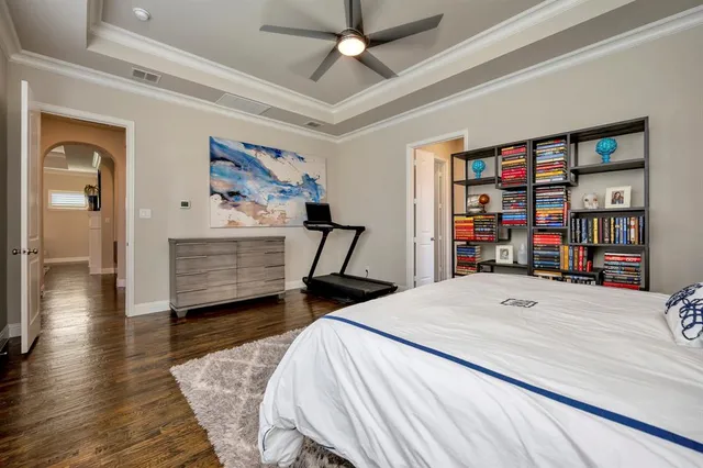 a bedroom with a bed and a book shelf