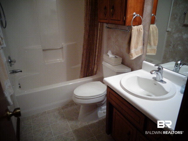 2804 Pine Ridge Drive Lillian, AL 36549 - Photo 25 of 39 Single vanity. Tub/shower enclosure. Squirrel cage fans with 4 switches - lights above sink and overhead, fan and night light. Vinyl floor.