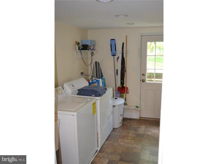 332 Landsende Road Devon, PA 19333 - Photo 14 of 15 a bathroom with a sink and a mirror