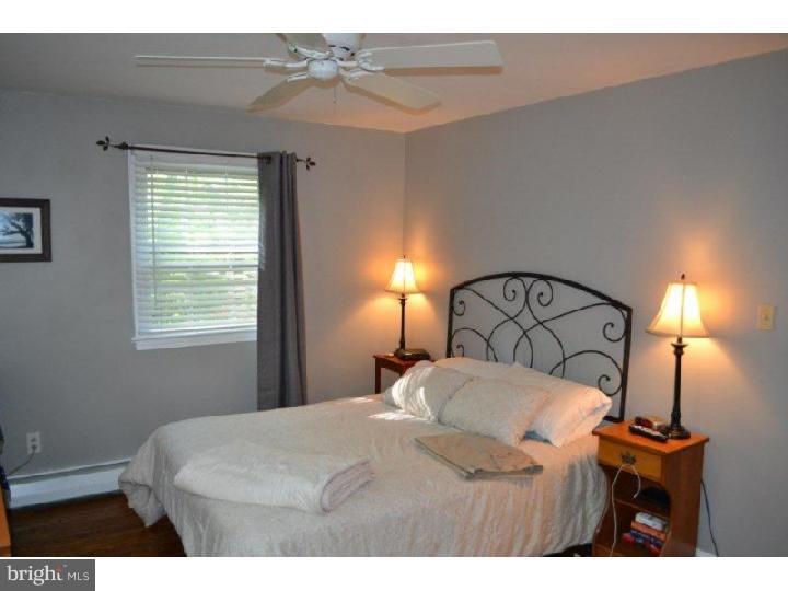 332 Landsende Road Devon, PA 19333 - Photo 8 of 15 a bedroom with a bed and a night stand