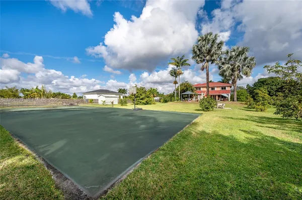 a view of a playground with basketball court