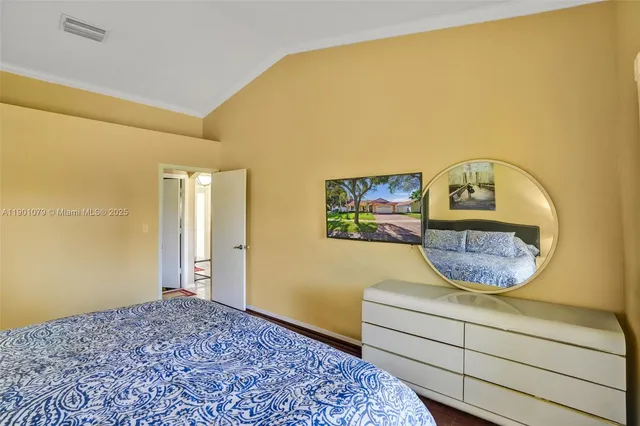 a view of a bedroom with a bed