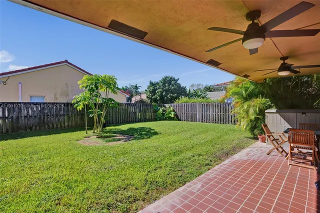 a view of a backyard with a patio
