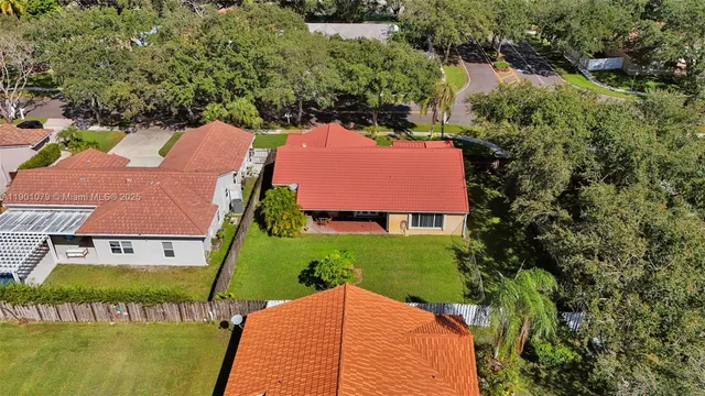 an aerial view of a house with a garden