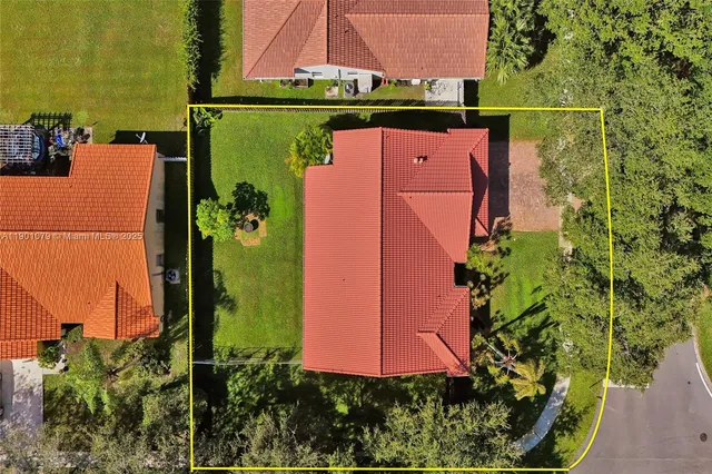 an aerial view of a house with a garden