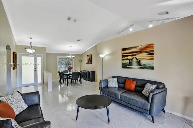 a living room with furniture and a table